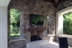 stacked stone fireplace with wood mantel picture