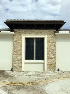 exterior window trim with stacked stone, casing and sill